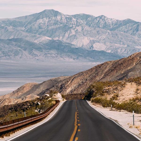 Landscape with road going into distance with mountains